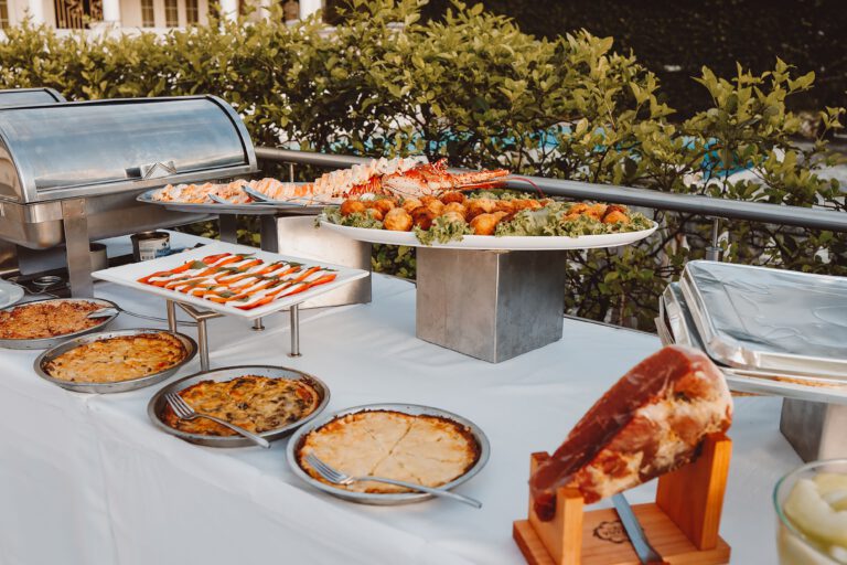 Home An inviting outdoor buffet offering a wide selection of fresh meals and delicacies.